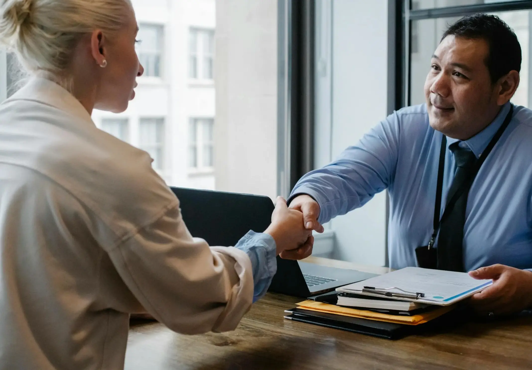 A man and a woman some dealing on table